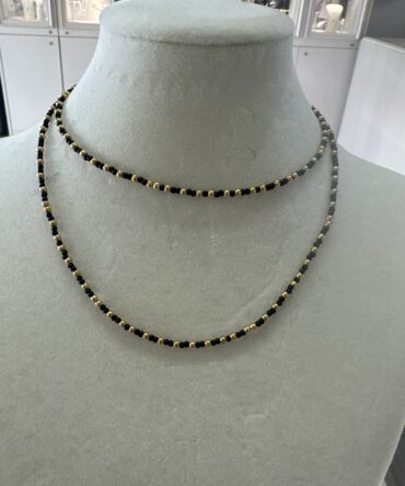 CO88: Collar en tonos negro y dorado